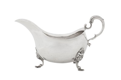 Lot 466 - An early George III Irish sterling silver sauce boat, Dublin circa 1760 by Samuel Walker (active 1731-69)