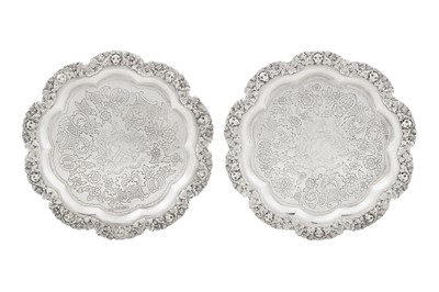 Lot 418 - A pair of George IV sterling silver salvers, London 1821 by Edward Farrell (reg. 27th April 1813)