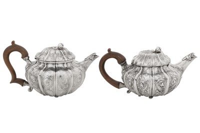 Lot 421 - A rare near pair of George IV sterling silver teapots, London 1820 by Joseph Biggs (reg. 26th Jan 1816)