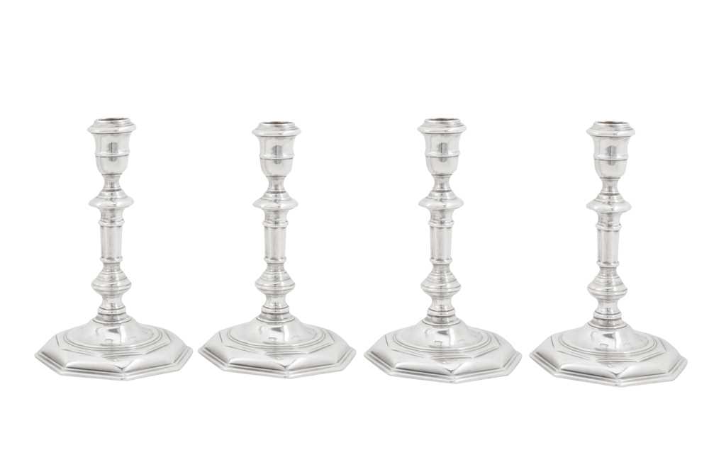 Lot 473 - An assembled set of four George I/II Irish silver candlesticks, Dublin 1724,25, 28 by Mathew Walker (active 1716-60)