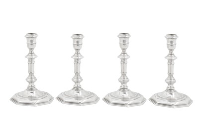 Lot 473 - An assembled set of four George I/II Irish silver candlesticks, Dublin 1724,25, 28 by Mathew Walker (active 1716-60)