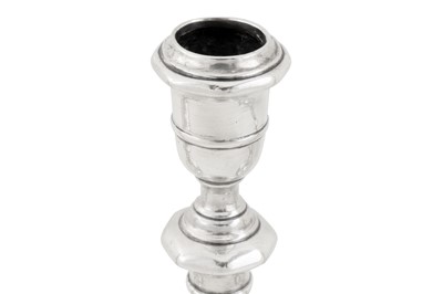 Lot 473 - An assembled set of four George I/II Irish silver candlesticks, Dublin 1724,25, 28 by Mathew Walker (active 1716-60)