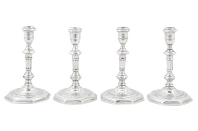 Lot 473 - An assembled set of four George I/II Irish silver candlesticks, Dublin 1724,25, 28 by Mathew Walker (active 1716-60)