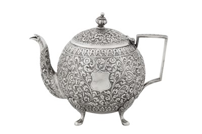 Lot 115 - A late 19th / early 20th century Anglo – Indian unmarked silver teapot, Cutch circa 1900