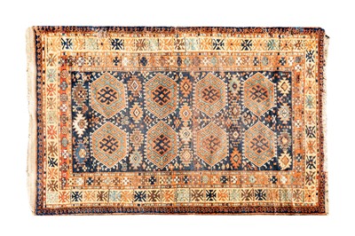 Lot 447 - AN ANTIQUE KURDISH RUG