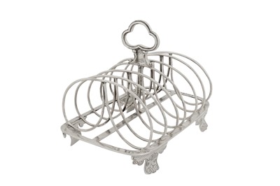 Lot 415 - A George IV provincial sterling silver seven bar toast rack, Chester 1828-29 by George Lowe