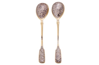 Lot 250 - A pair of Alexander II mid-19th century Russian 84 zolotnik silver gilt and niello spoons, Moscow 1859 by Andrey Vekman (active 1860-1884)