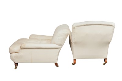 Lot 69 - A near pair of deep seated upholstered Howard & Sons armchairs, early 20th Century