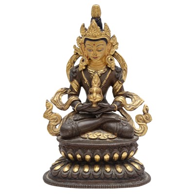 Lot 228 - A Sino-Tibetan parcel-gilt bronze figure of Amitayus, Qing Dynasty, 18th century
