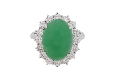 Lot 140 - A JADE AND DIAMOND CLUSTER RING