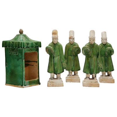 Lot 671 - Four Chinese green-glazed figures with a sedan, Ming dynasty