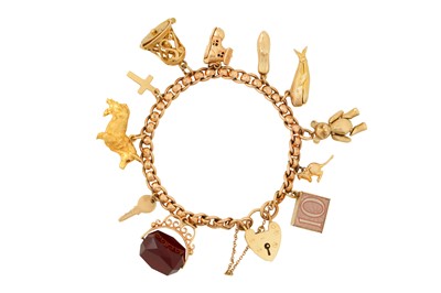 Lot 56 - A GOLD CHARM BRACELET, CIRCA 1955