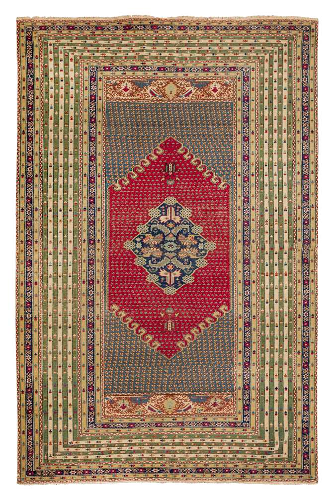 Lot 58 - AN ANTIQUE GHIORDES RUG, TURKEY