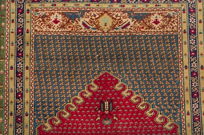 Lot 58 - AN ANTIQUE GHIORDES RUG, TURKEY