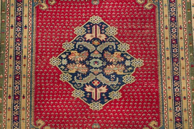 Lot 58 - AN ANTIQUE GHIORDES RUG, TURKEY