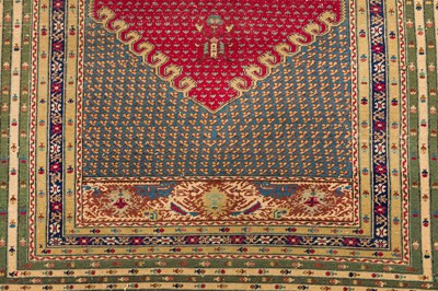 Lot 58 - AN ANTIQUE GHIORDES RUG, TURKEY