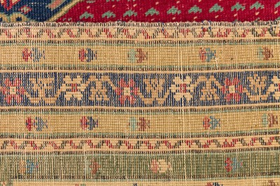 Lot 58 - AN ANTIQUE GHIORDES RUG, TURKEY