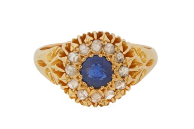 Lot 23 - A SAPPHIRE AND DIAMOND HALO RING, CIRCA 1906