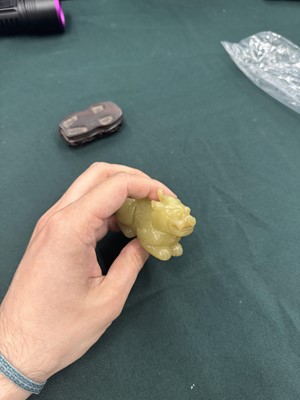 Lot 62 - A CHINESE YELLOW JADE CARVING OF A MYTHICAL BEAST