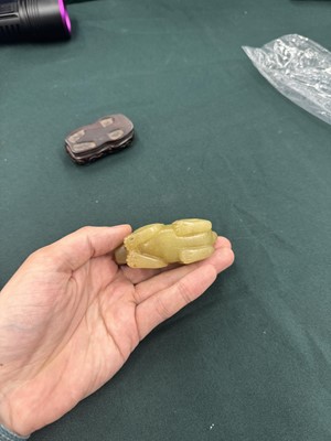 Lot 62 - A CHINESE YELLOW JADE CARVING OF A MYTHICAL BEAST