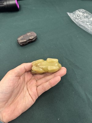 Lot 62 - A CHINESE YELLOW JADE CARVING OF A MYTHICAL BEAST