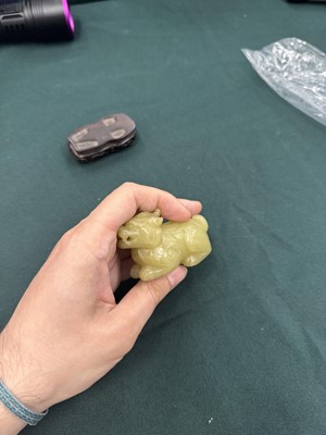 Lot 62 - A CHINESE YELLOW JADE CARVING OF A MYTHICAL BEAST