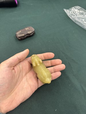 Lot 62 - A CHINESE YELLOW JADE CARVING OF A MYTHICAL BEAST