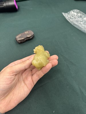 Lot 62 - A CHINESE YELLOW JADE CARVING OF A MYTHICAL BEAST