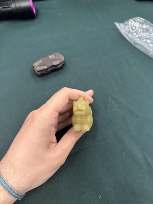 Lot 62 - A CHINESE YELLOW JADE CARVING OF A MYTHICAL BEAST