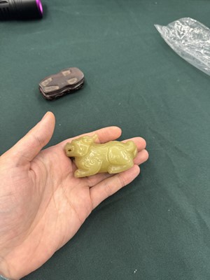 Lot 62 - A CHINESE YELLOW JADE CARVING OF A MYTHICAL BEAST