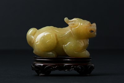 Lot 62 - A CHINESE YELLOW JADE CARVING OF A MYTHICAL BEAST