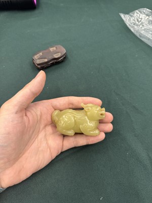 Lot 62 - A CHINESE YELLOW JADE CARVING OF A MYTHICAL BEAST