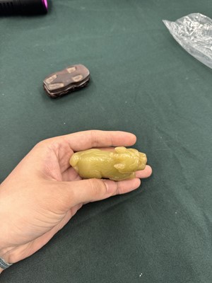 Lot 62 - A CHINESE YELLOW JADE CARVING OF A MYTHICAL BEAST