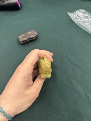 Lot 62 - A CHINESE YELLOW JADE CARVING OF A MYTHICAL BEAST