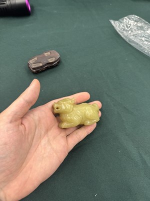 Lot 62 - A CHINESE YELLOW JADE CARVING OF A MYTHICAL BEAST
