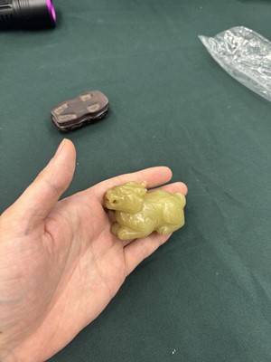 Lot 62 - A CHINESE YELLOW JADE CARVING OF A MYTHICAL BEAST