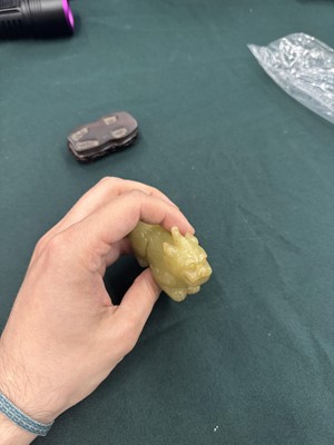 Lot 62 - A CHINESE YELLOW JADE CARVING OF A MYTHICAL BEAST