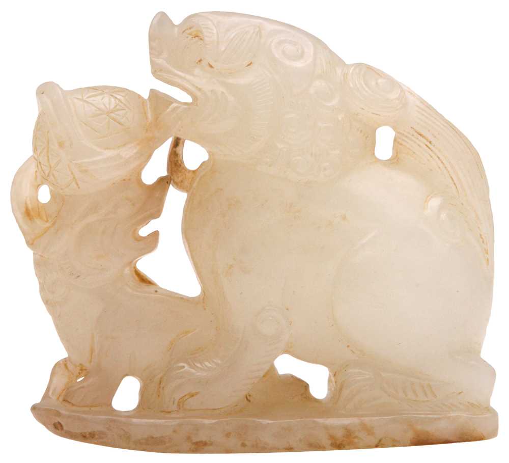 Lot 96 - A CHINESE CELADON JADE 'LION DOG' GROUP