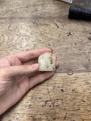 Lot 96 - A CHINESE CELADON JADE 'LION DOG' GROUP