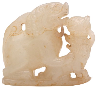 Lot 96 - A CHINESE CELADON JADE 'LION DOG' GROUP