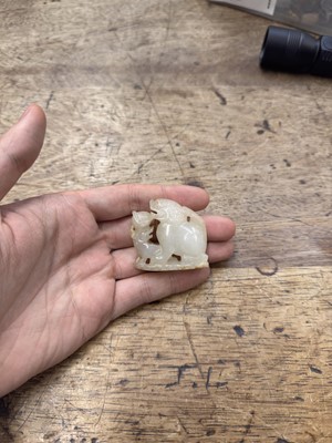 Lot 96 - A CHINESE CELADON JADE 'LION DOG' GROUP