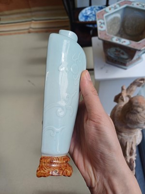 Lot 511 - A Chinese celadon glazed and faux-bois 'chilong' wall vase, 19th/20th century