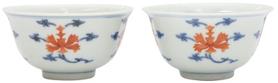 Lot 516 - A pair of Chinese iron-red and underglaze blue 'lotus' bowls, 20th Century