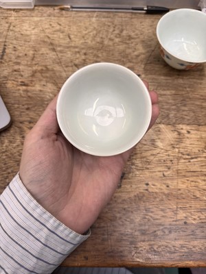 Lot 516 - A pair of Chinese iron-red and underglaze blue 'lotus' bowls, 20th Century