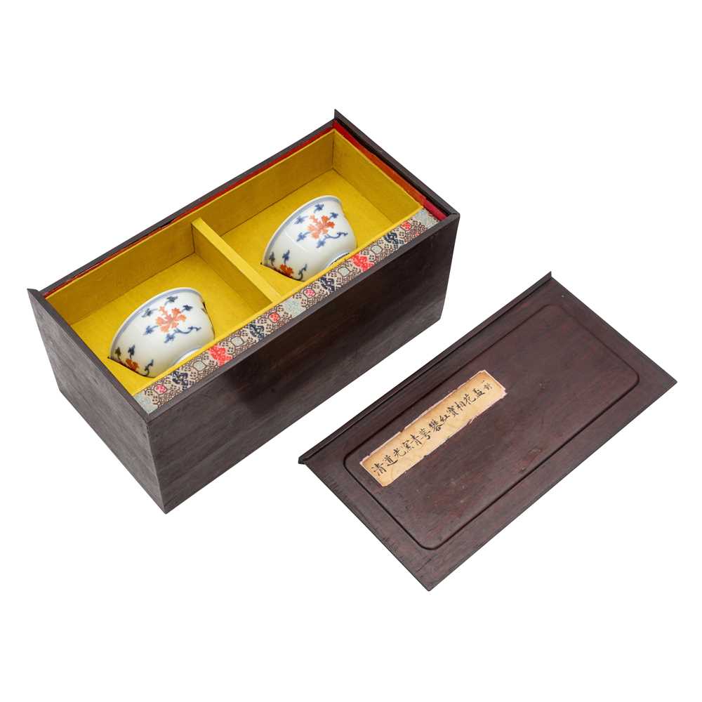 Lot 516 - A pair of Chinese iron-red and underglaze blue 'lotus' bowls, 20th Century