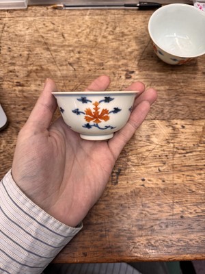 Lot 516 - A pair of Chinese iron-red and underglaze blue 'lotus' bowls, 20th Century
