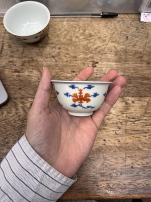 Lot 516 - A pair of Chinese iron-red and underglaze blue 'lotus' bowls, 20th Century