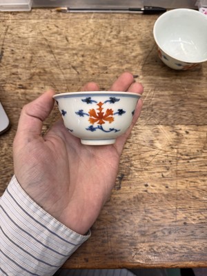 Lot 516 - A pair of Chinese iron-red and underglaze blue 'lotus' bowls, 20th Century