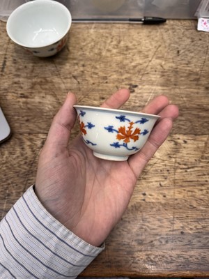 Lot 516 - A pair of Chinese iron-red and underglaze blue 'lotus' bowls, 20th Century