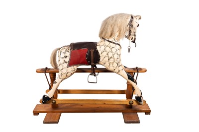 Lot 419 - AN EARLY 20TH CENTURY DAPPLE WHITE ROCKING HORSE